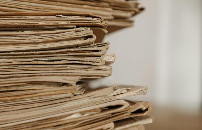 This picture shows a pile of old files on top of each other